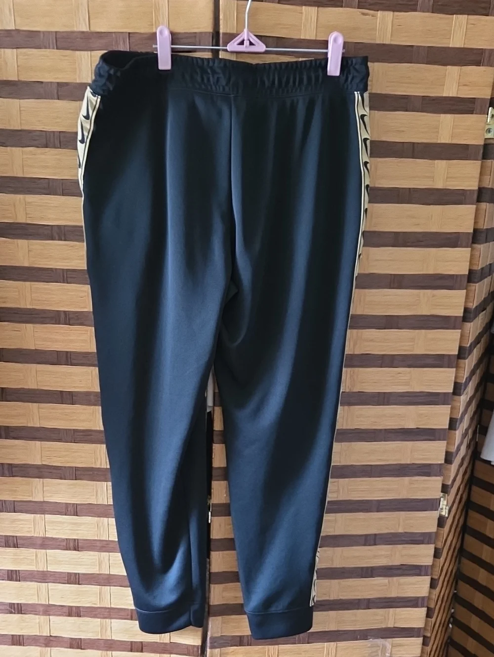Nike  Black Track Pants with Contrasting Gold Side Stripe